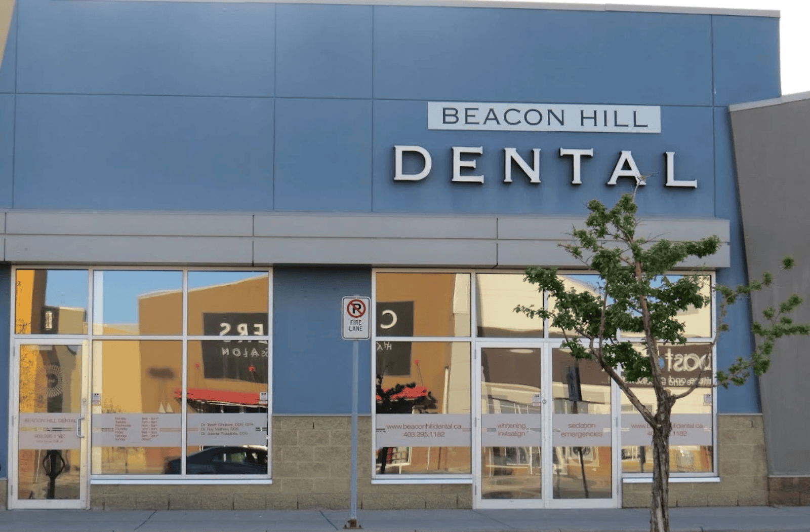 Exterior view of Beacon Hill Dental clinic storefront with signage, large windows, and street-level entrance